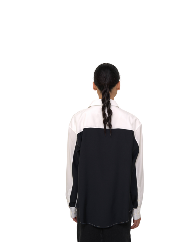 Back view of female model in Vault Urban monochrome Stay Fresh shirt – wrinkle-free sustainable workwear