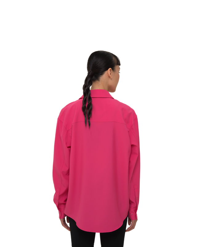 Back view of female model in Vault Urban pink Stay Fresh shirt – wrinkle-free sustainable workwear