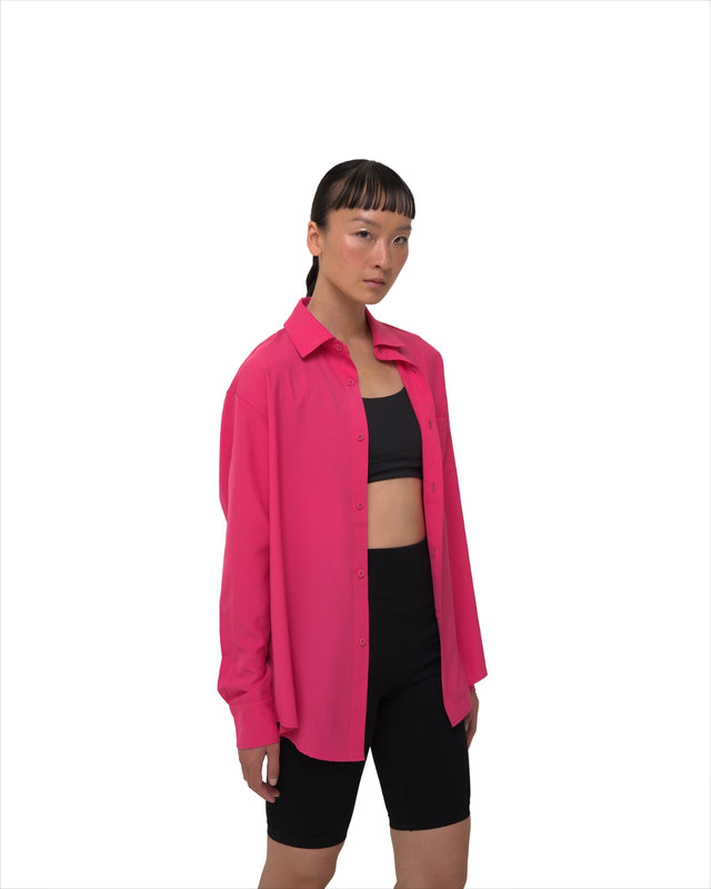 Female model side profile in Vault Urban pink Stay Fresh shirt – ethical women’s office wear