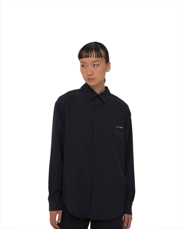 Female model wearing Vault Urban Stay-Fresh Wrinkle-Free Shirt in Black – front view