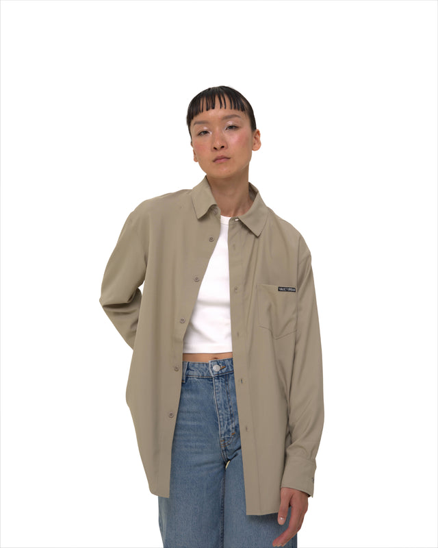 Female model wearing Vault Urban Stay-Fresh Wrinkle-Free Shirt in Taupe – front view