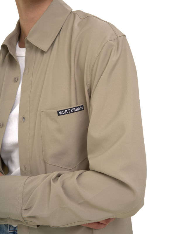 Close-up of Vault Urban logo on Stay-Fresh Wrinkle-Free Taupe Shirt pocket female fit