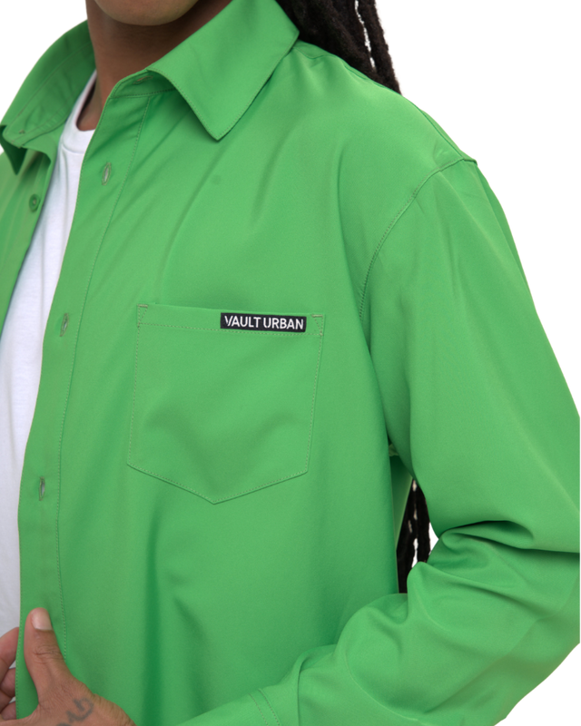 Vault Urban green performance shirt with chest pocket and logo detail, styled over a white t-shirt