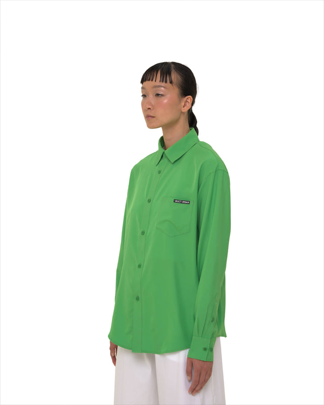 Angled view of female model in Vault Urban green Stay Fresh shirt – versatile office wear