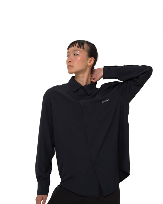 Female model wearing Vault Urban Stay-Fresh Wrinkle-Free Shirt in Black – front view in motion